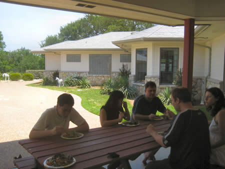 A photo given to me by Gary showing Alpha Leaders eating next to the BBQ. You can see some of the backyard of Stephen and Alicia's place. Their swimming pool is to the left of the photo.